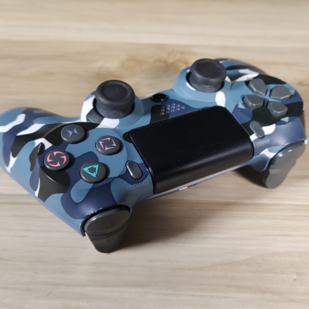 DualShock 4 Wireless Controller for the PlayStation 4 in the Blue CamoCamouflage
